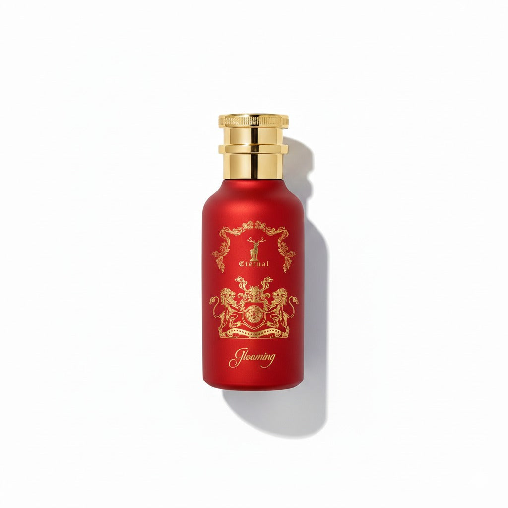 Red perfume bottle with gold cap and decorative label on a white background